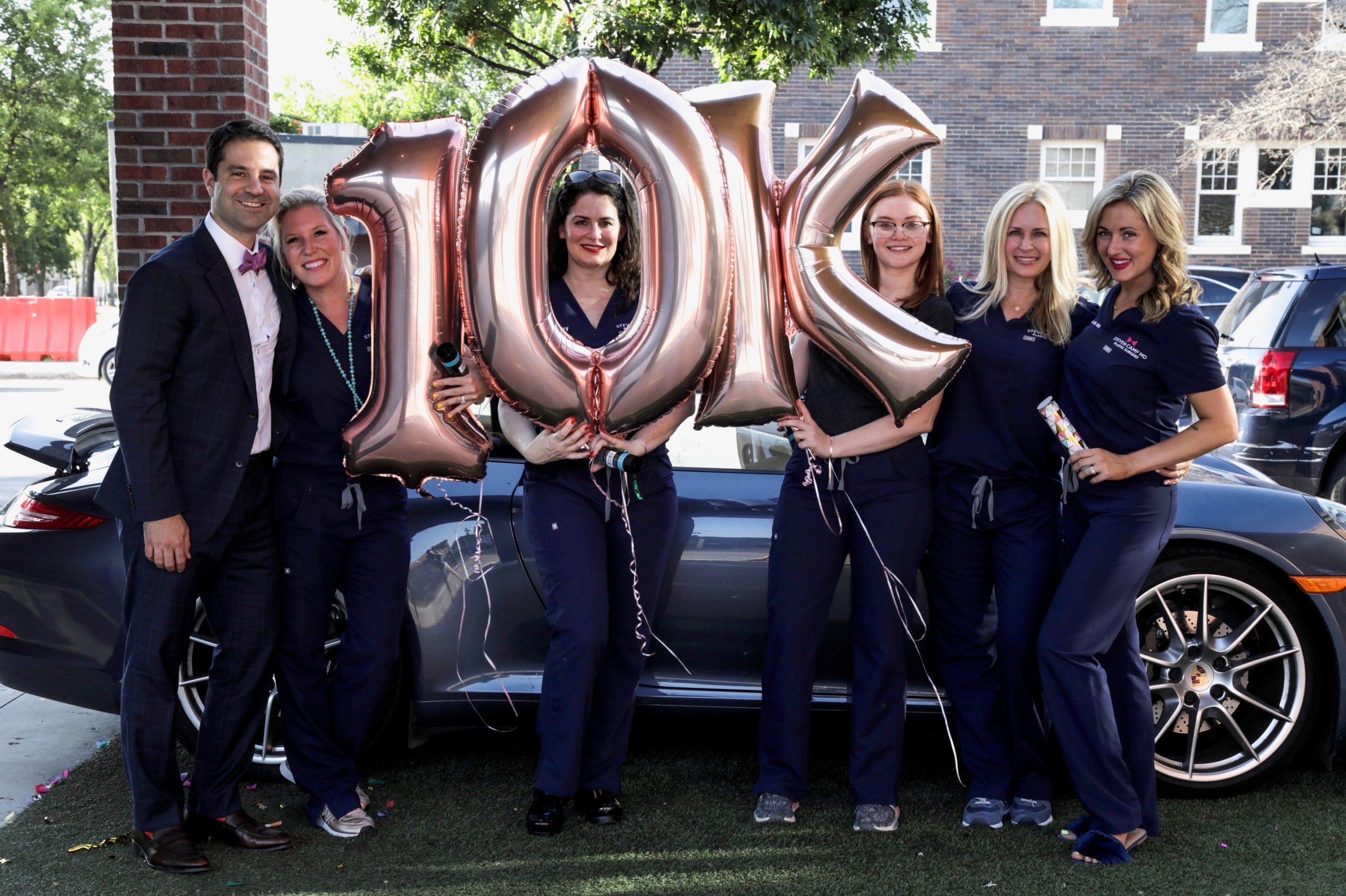 Dr Camp and staff celebrating 10,000 Instagram follower