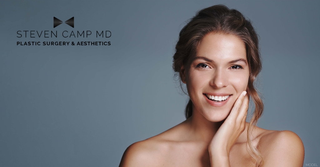 Woman smiling from laser skin resurfacing treatment (model)